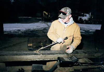 Metal pieces are meticulously removed from the lumber, minimizing damage to the wood.