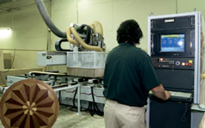 An operator monitors a router in action.
