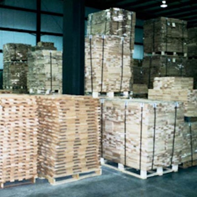 Small slats of hardwood wait to be cut into veneers for a floating longstrip floor.