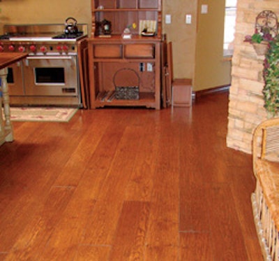 Good subfloor preparation is vital to successfully installing beautiful glue-down floors such as this engineered wide-plank floor (courtesy of Benchmark Wood Floors).