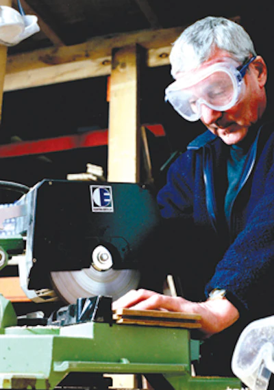 Storeman Gerry Reilly cuts timbers to suit a floor's design.