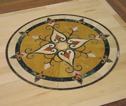 Beautiful stone medallions add an upscale element to a floor while being relatively easy to install.