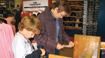 Smith and her son choose gifts to give to his Little League teammates at the pizza party that night.