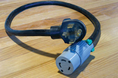 This pigtail for connecting the 3-wire to a 4-wire outlet might be illegal—it depends if the white and green wires are joined together inside the cord (joining them is illegal).