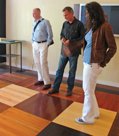 At the Manhattan showroom, Downs reviews flooring options with Mark Skinner and Aimee Morris of Skinner Interiors.
