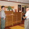 Schmidt shows Long his homemade flooring dressers.