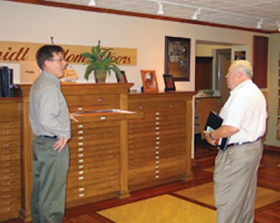 Schmidt shows Long his homemade flooring dressers.