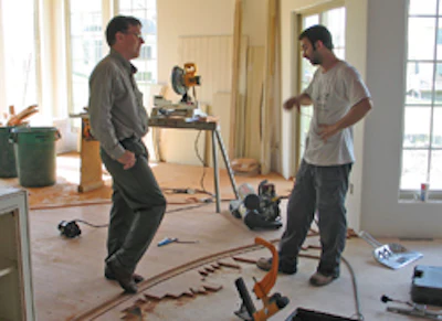 Schmidt and installer Schneeweis discuss the intricacies of installing ribbons.