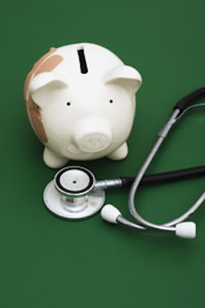 Photo of a stethoscope next to a piggy bank