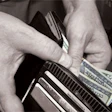 Photo of a wallet full of cash