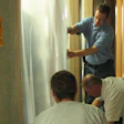 Contractors at a Lead Safe Renovator class in Madison, Wis., prepare a doorway for dust containment.