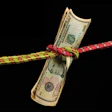 Photo of dollar stretched tight