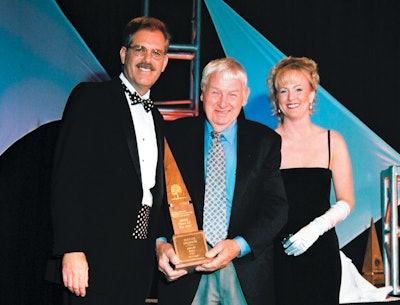 Birger Juell receives one of the company's many Wood Floor of the Year trophies at the 2001 NWFA Convention in Palm Springs, Calif.