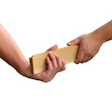 Photo of one hand passing the other a piece of hardwood floor