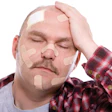 Adult man with his head covered in band aids