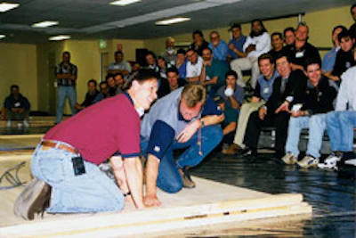 Daniel Boone (at left) leads a wood flooring school in Australia in June, 1999.