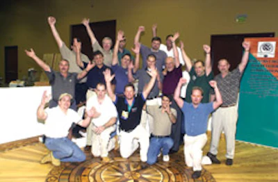 Participants in the winning Designer's Choice award celebrate at the National Wood Flooring Association's convention in Orlando in April 2002.