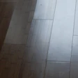 Glue lines visible in a cupped bamboo floor