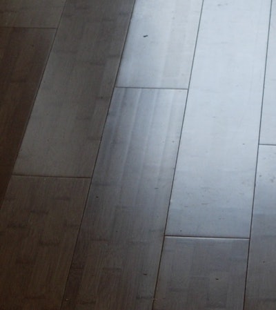 Glue lines visible in a cupped bamboo floor