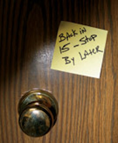 Photo of a post-it note on a door saying 'Be Back in 15'