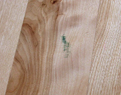 Mystery marks such as this green smudge are an unknown as to whether they will or won't come out.