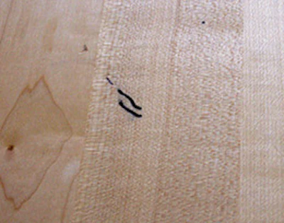 It's likely that these marks from a Sharpie marker have penetrated most of the finish and won't come out with a recoat.