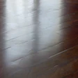 Brazilian cherry floor that appears to have nonuniform gaps.JPG