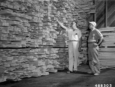 At left, patriarch Viandel 'Spider' Smith escorting a customer through a warehouse, circa 1950. (Photo courtesy of the Forest History Society, Durham, N.C.)