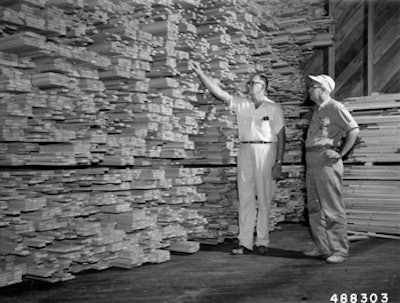 At left, patriarch Viandel 'Spider' Smith escorting a customer through a warehouse, circa 1950. (Photo courtesy of the Forest History Society, Durham, N.C.)