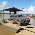 The truck, with all four wheels properly inflated and a freshly repaired spare, backs onto the ferry ...