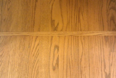 New poly finish on an oak wood floor matches existing finish