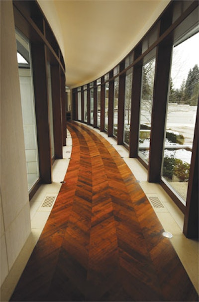 Photo of a herringbone floor running a curved hallway