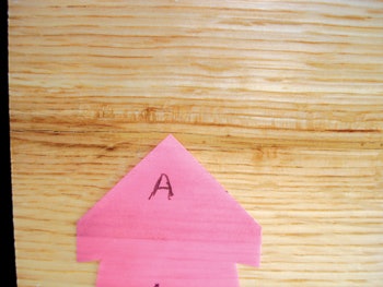 photo of a check in a wooden board