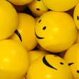 photo of yellow smiley face ping-pong balls