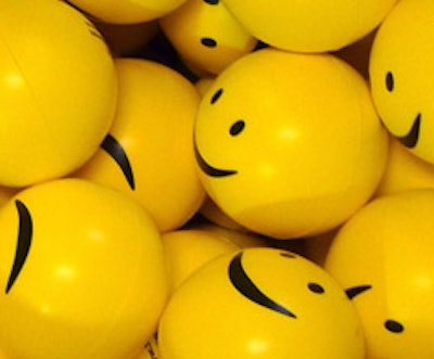 photo of yellow smiley face ping-pong balls