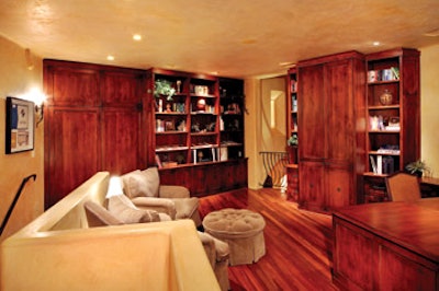 photo of living room with wood flooring and built-ins