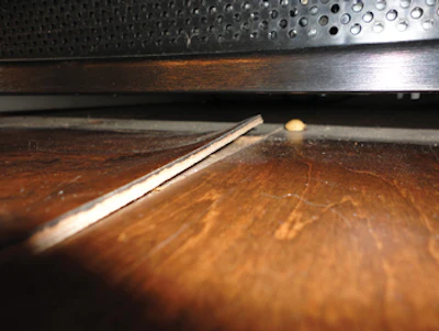 The wear layer is delaminating from this flooring after being installed in a job site with low relatively humidity conditions.