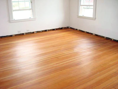 Don Dickel repairs wood flooring at Maine's Rockland Breakwater Lighthouse