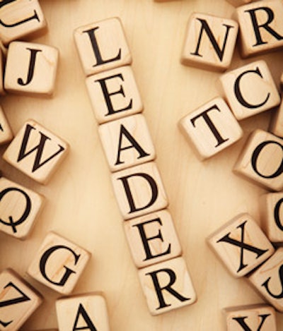 photo of wood blocks forming the word 'leader'