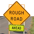 photo of sign saying 'Rough Road Ahead'