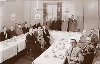 In 1957, MFMA members meet to celebrate the association's 60th anniversary. From left to right: J.B. Albee, MFMA field engineer; Roy Ahonen, Ahonen Lumber Company; G.K. Nixon, Oval Wood Dish Company; P. Fred Taylor, Connor Lumber Co.; Lloyd M. Clady, MFMA secretary/manager; Donald DeWitt, Holt Hardwood Company; William W. Gamble, Yawkey-Bissell Hardwood Flooring; W.C. Abendroth, Robbins Hardwood Flooring; Sam A. Wells, J.W. Wells Lumber Company; Peter S. Gamble, Yawkey-Bissell Flooring Company; C.A. Brand, North Branch Flooring Company; J.C. Christie, Robbins Flooring Company; Carl W. Abendroth, Robbins Flooring Company. In foreground from front: B.R. Millington, North Branch Flooring Company; Edward J. Stone, Horner Flooring Company; Hugh Reading, representative from Kramer Kraslet (advertising firm).