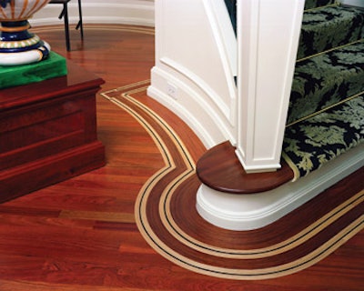 This Endurance Floor Company floor features walnut and ebony bent into a field of Brazilian cherry.