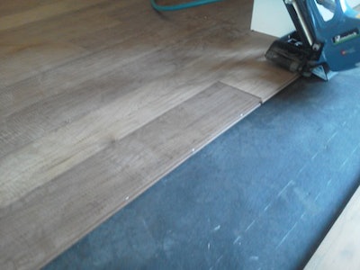 Thermotreated maple wood floor with Primatech nailer on wheels