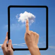 photo of finger pointing to cloud through a black frame