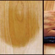 Photo of sanding a hair out of wood floor finish