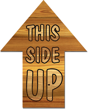 Photo of arrow sign that says This Side Up