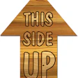 Photo of arrow sign that says This Side Up