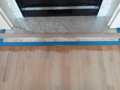 wood floor trick to protect marble fireplace
