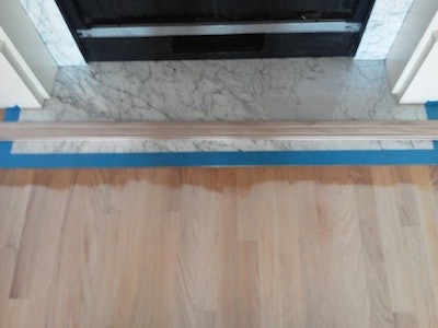 wood floor trick to protect marble fireplace