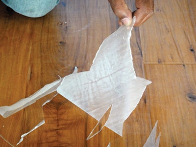 When this prefinished floor was recoated, the finish formed a nice, even film, and abrasion marks on the bottom of the peeling indicated plenty of abrasion, but this was one of those floors that simply could not be recoated. No pre-test for adhesion had been done before coating. (Photo courtesy of Bona US)